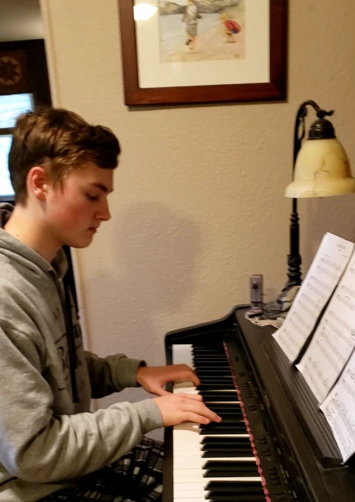 Caleb playing the piano