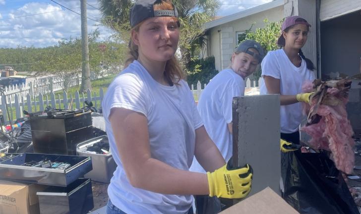 students helping after hurricane